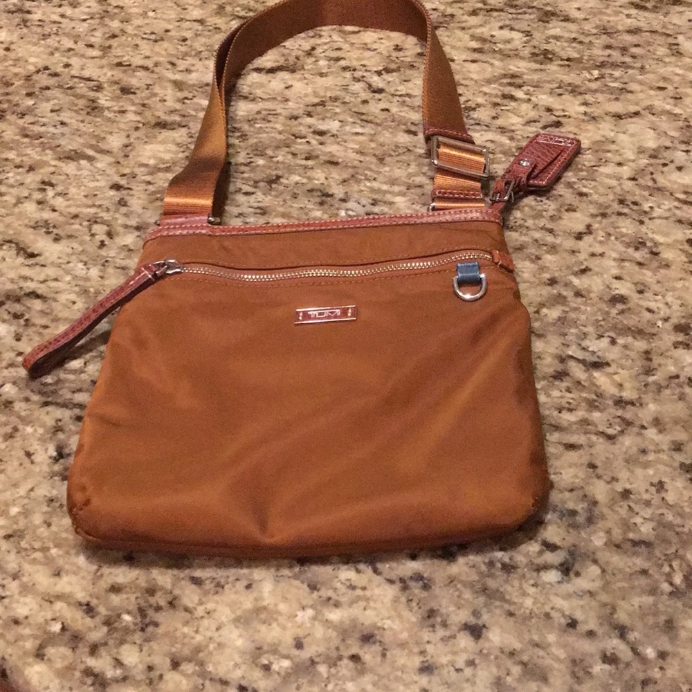 Tumi Cross body bag.